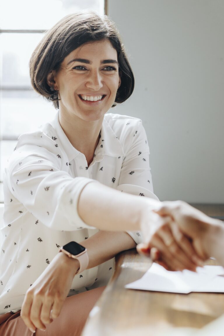 Happy businesswomen doing a handshake