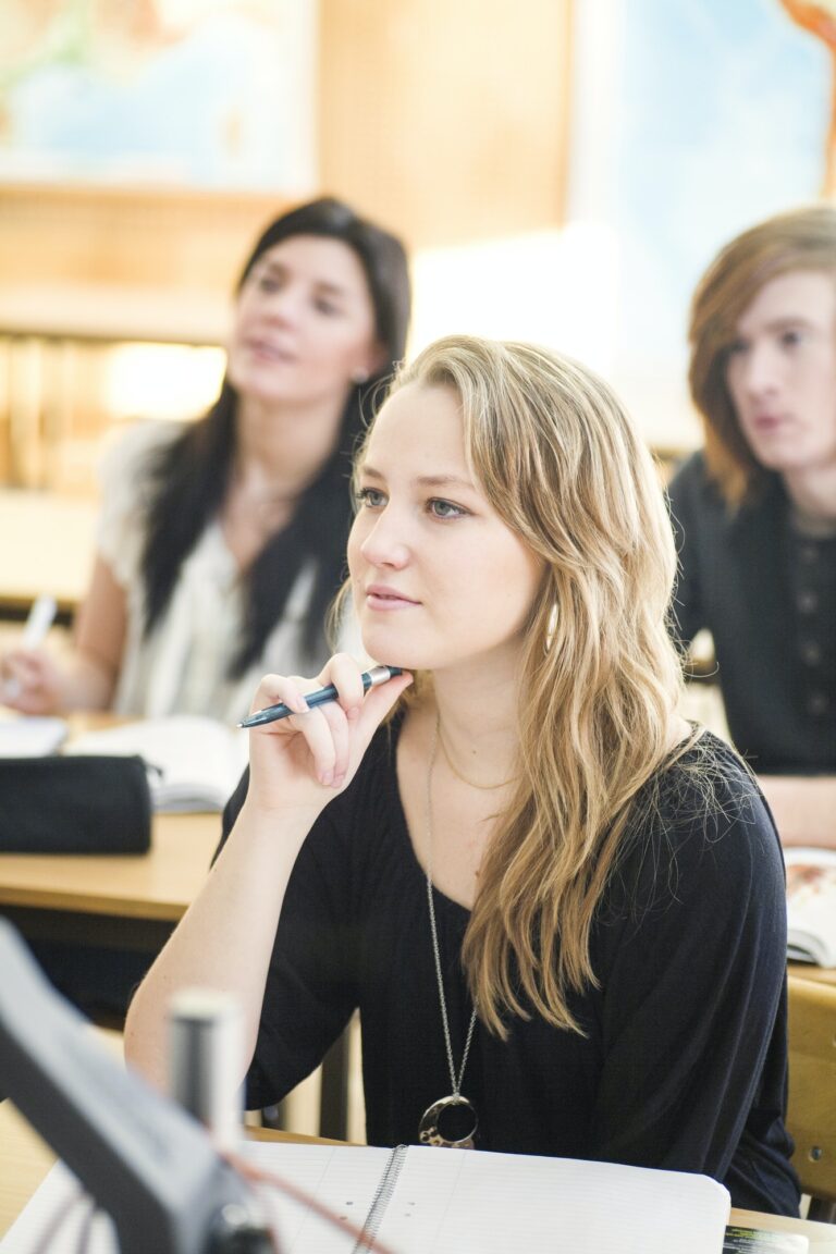 High school students listening to lecture in classroom